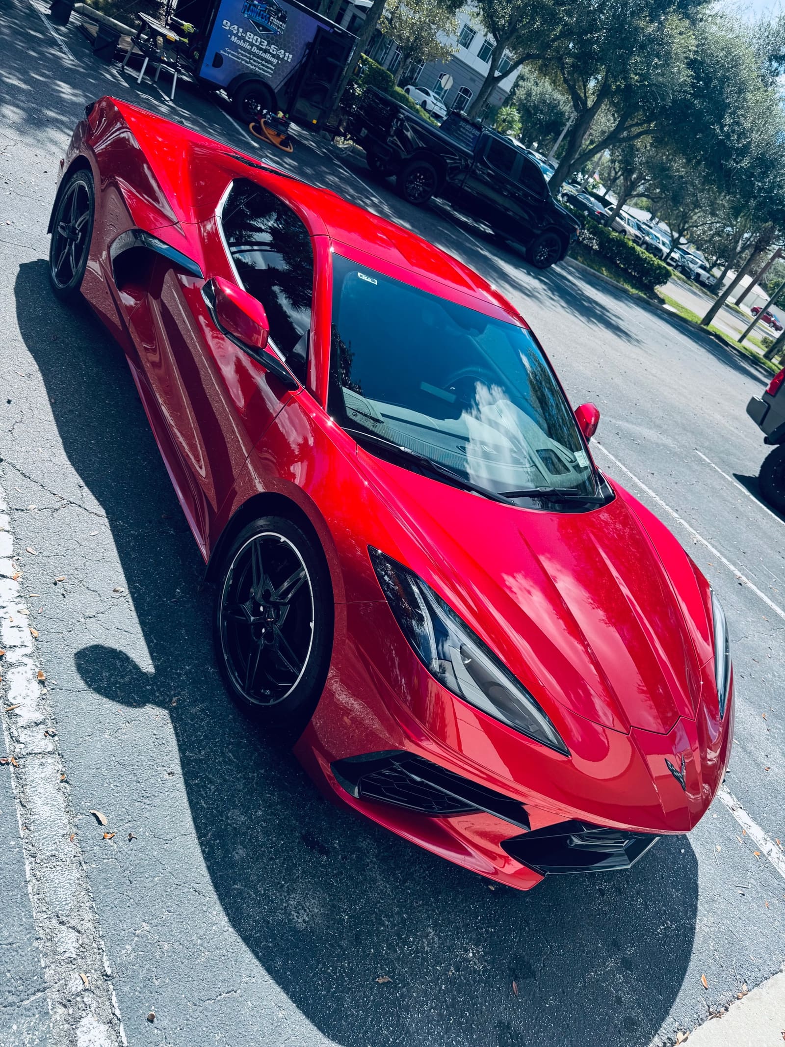 A red sports car with a deep gloss finish