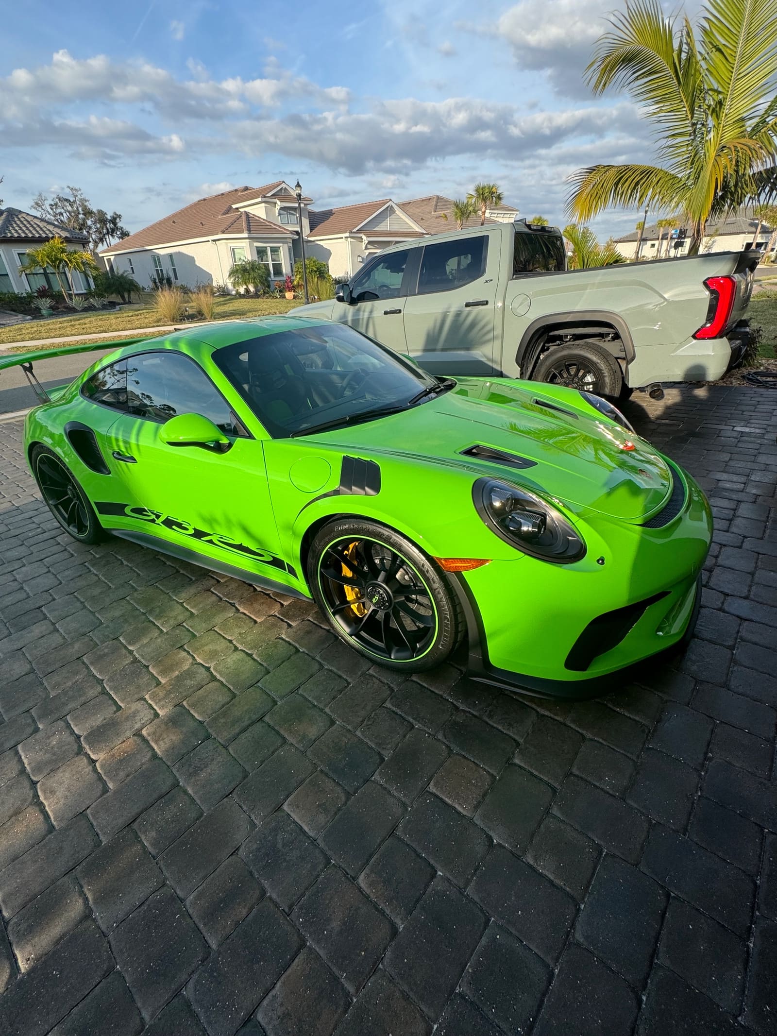 A green track car detailed by Flawless Finish