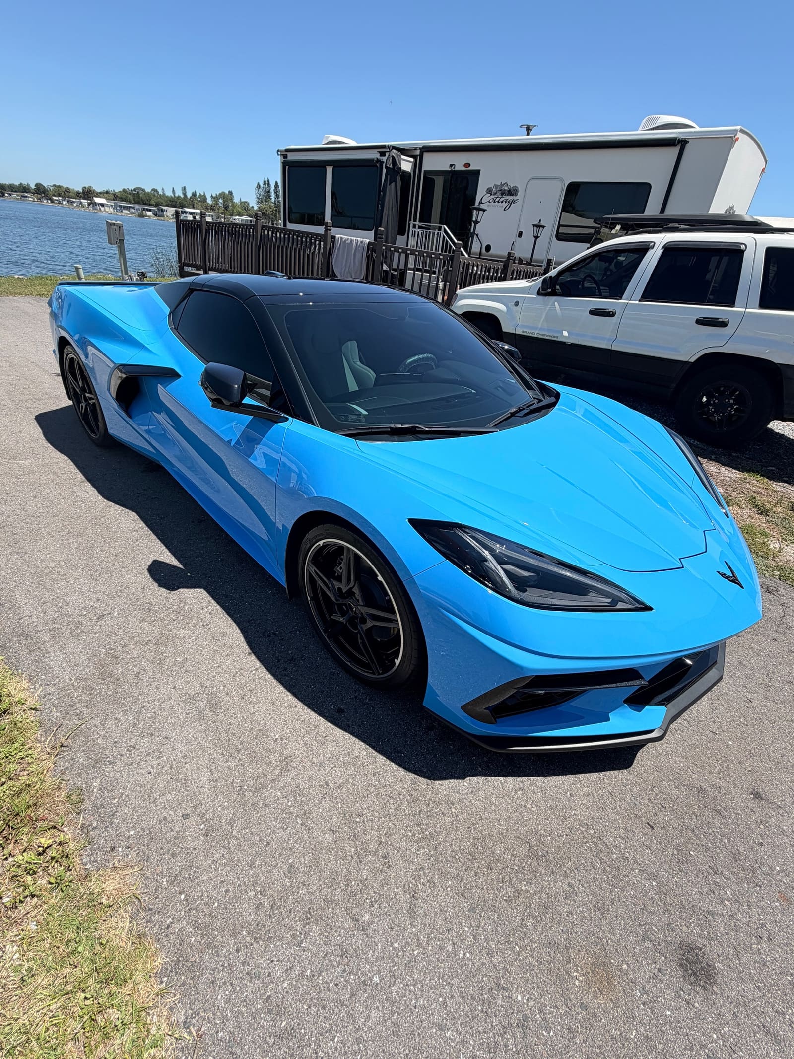 A light blue sports car after a full exterior detail
